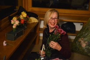 Lop&ouml;n Barabara Ryan arranging the flowers for the shrine.
